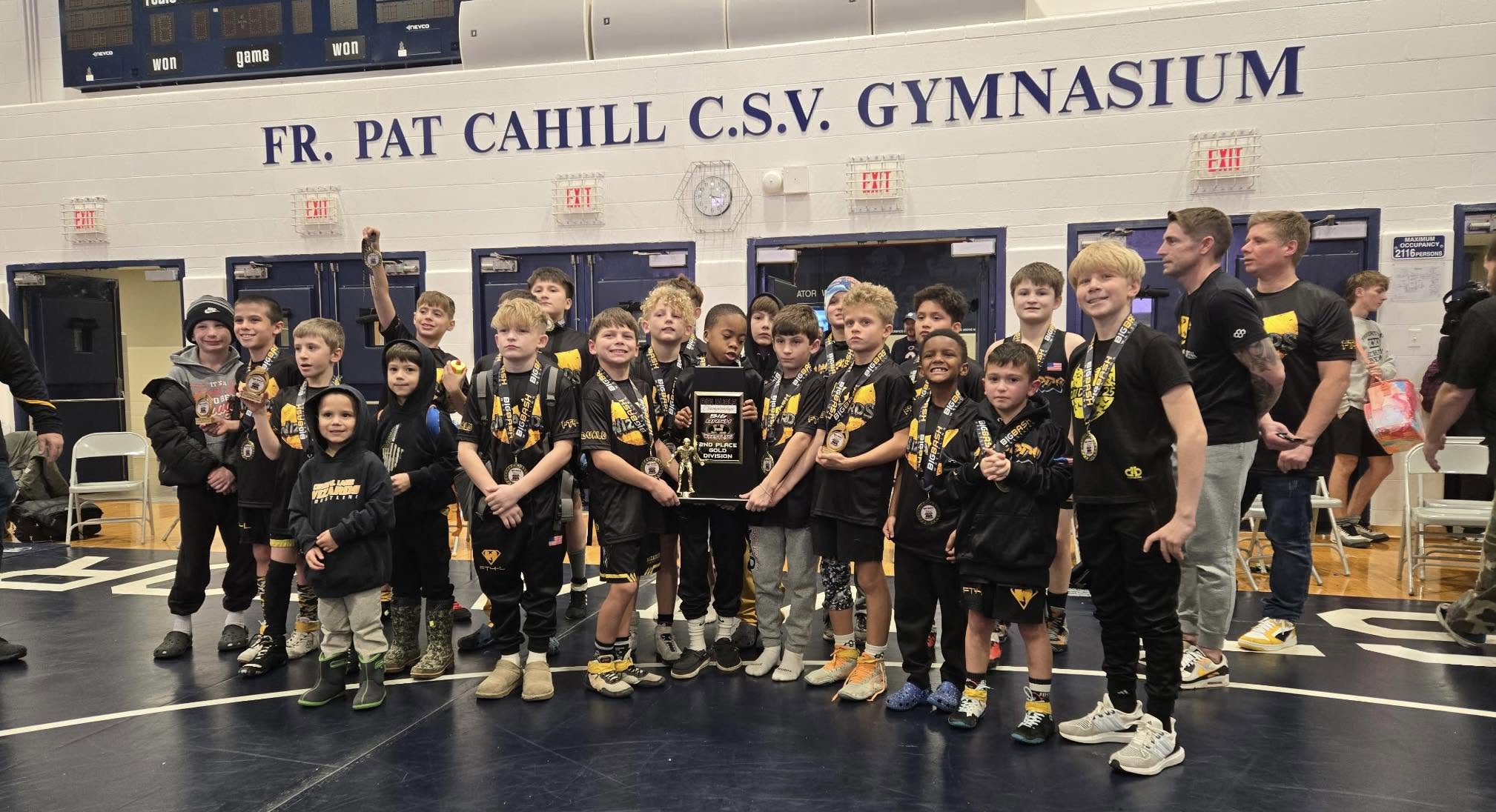 Wizards wrestlers celebrating a win